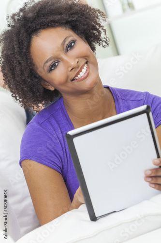 Photo: Mixed Race African American Girl Using Tablet Computer Mixed Race African American Girl Using Tablet Computer