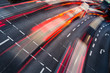 Motion blurred city road traffic (color toned  image)