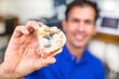 Dental technician presenting dental prosthesis