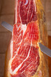 Slicing Spanish jamon iberico (ham)