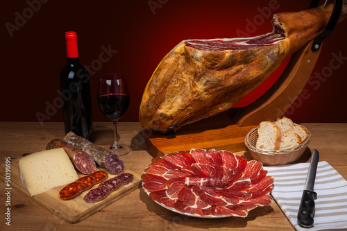 Photo: Different spanish embutidos: jamon, chorizo, salami, cheese Different spanish embutidos: jamon, chorizo, salami, cheese