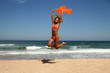 Beautiful tanned woman enjoying the sun on the beach.