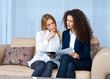 woman friends at home reading