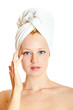 portrait of a beautiful blonde with white towel on her head