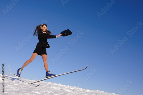 Photo: young businesswoman jumping young businesswoman jumping