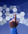 Foto: Hand pushing button on virtual screen Hand pushing button on virtual screen