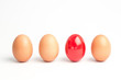 Four eggs in a row with one red one