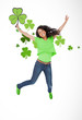 Girl jumping with shamrocks