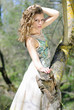 beautiful girl in green wood by summer