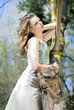 beautiful girl in green wood by summer