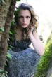 beautiful girl in green wood by summer