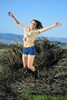 beautiful girl in shorts and hat on grapevine