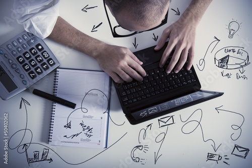 Photo: Multitasking businessman at work Multitasking businessman at work