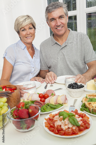 Photo: Middle Aged Couple Healthy Eating Salad Table Middle Aged Couple Healthy Eating Salad Table