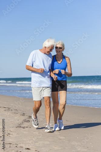 Photo: Healthy Senior Couple Running Jogging on Beach Healthy Senior Couple Running Jogging on Beach