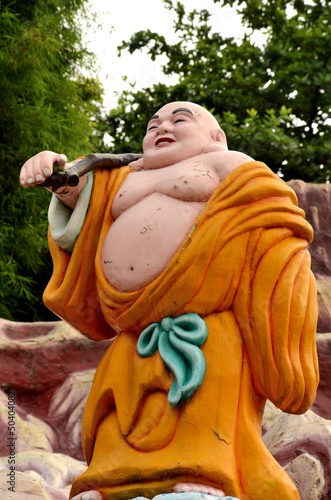 Photo: Laughing Buddhist monk on journey Laughing Buddhist monk on journey