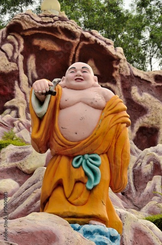 Photo: Laughing Buddhist monk on journey Laughing Buddhist monk on journey
