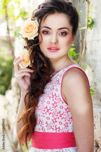 Photo: Beautiful woman with flowers in her hair Beautiful woman with flowers in her hair