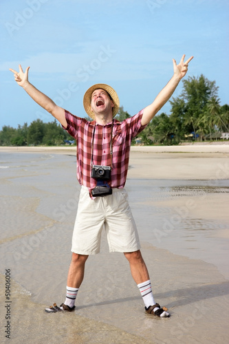Photo: happy tourist on beach happy tourist on beach