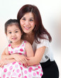 Mother hugging her daughter