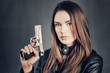 woman holding up her gun
