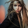 Young sensual model girl. Color face art studio photo.
