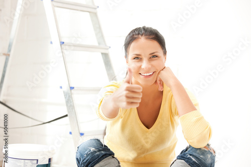 Photo: lovely housewife making repairing works lovely housewife making repairing works