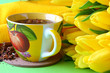 Tea cups and yellow tulips