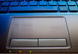 close up of laptop keyboard as a background toned to blue