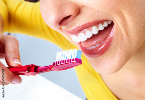 Photo: Beautiful woman with a toothbrush. Beautiful woman with a toothbrush.