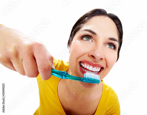 Photo: Beautiful woman with a toothbrush. Beautiful woman with a toothbrush.