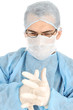Young doctor wears protective rubber gloves before surgery