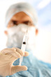 Doctor holding injection vaccine