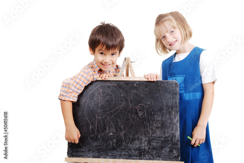 Photo: Schoolkids writing stuff on blackboard Schoolkids writing stuff on blackboard