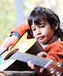 Male adult playing guitar