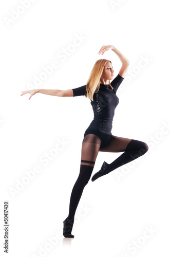 Photo: Young woman dancing on white background Young woman dancing on white background