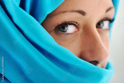 Photo: Young beautiful muslim woman in blue scarf Young beautiful muslim woman in blue scarf