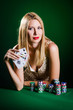 Woman in casino playing cards
