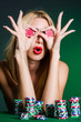 Woman in casino playing cards