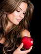 Beautiful woman holding an apple