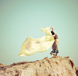 Young woman walking in a desert