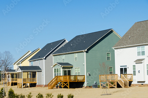 Photo: Residential houses row backyard view Residential houses row backyard view