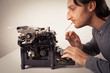 Man thinking at typewriter