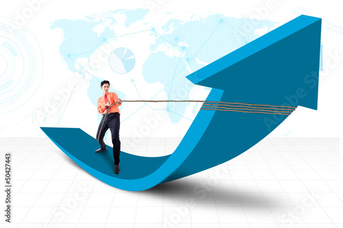 Photo: Businessman pull arrow on world map background Businessman pull arrow on world map background