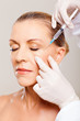 senior woman receiving plastic surgery injection