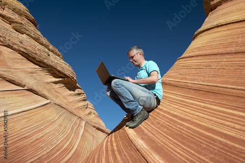 Photo: Business man in a canyon Business man in a canyon