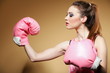 Female boxer model with big fun pink gloves