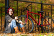 Urban biking - girl and bike in city park