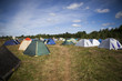 tent on a grass under white clouds
