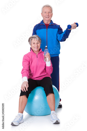 Photo: Portrait Of A Senior Couple Exercising Portrait Of A Senior Couple Exercising